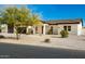 New construction home with a modern design, featuring a large driveway and two-car garage at 2917 N Katie Ln, Litchfield Park, AZ 85340