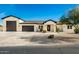 New construction home with a modern design, featuring a large driveway and two-car garage at 2917 N Katie Ln, Litchfield Park, AZ 85340