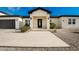 Modern front entrance with a black metal door and walkway at 2917 N Katie Ln, Litchfield Park, AZ 85340