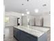 Kitchen island with granite countertop in bright and open space at 2917 N Katie Ln, Litchfield Park, AZ 85340