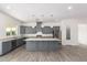 Modern kitchen with gray cabinets and granite countertops at 2917 N Katie Ln, Litchfield Park, AZ 85340