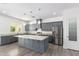 Modern kitchen with gray cabinets and granite countertops at 2917 N Katie Ln, Litchfield Park, AZ 85340