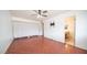 Bedroom with bathroom access and ceiling fan at 3433 W Mescal St, Phoenix, AZ 85029