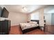 Cozy bedroom with a double bed and wood flooring at 3433 W Mescal St, Phoenix, AZ 85029