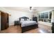 Bedroom with a queen-size bed and wood floors at 3433 W Mescal St, Phoenix, AZ 85029