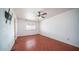 Spacious bedroom with ceiling fan and neutral colored walls at 3433 W Mescal St, Phoenix, AZ 85029