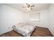 Bright bedroom with wood floors and ceiling fan at 3433 W Mescal St, Phoenix, AZ 85029