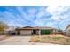 One-story home with attached garage and mature landscaping at 3433 W Mescal St, Phoenix, AZ 85029