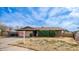 Brick ranch home with a two-car garage and front yard at 3433 W Mescal St, Phoenix, AZ 85029