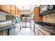 Kitchen with granite countertops and pool view at 3433 W Mescal St, Phoenix, AZ 85029