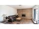 Living room with a brick fireplace and wood floors at 3433 W Mescal St, Phoenix, AZ 85029