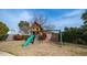 Wooden playset with slide and swings in the backyard at 3433 W Mescal St, Phoenix, AZ 85029
