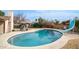 Relaxing kidney-shaped pool with slide and lounge chairs at 3433 W Mescal St, Phoenix, AZ 85029