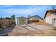 White storage shed with gravel pathway and fenced yard at 3433 W Mescal St, Phoenix, AZ 85029