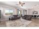 Relaxing living room with comfortable seating and a ceiling fan at 3531 E Peartree Ln, Gilbert, AZ 85298