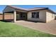 This backyard is designed with artificial grass for low maintenance at 4866 N 185Th Dr, Goodyear, AZ 85395