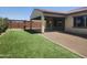 Green turf with gravel and pergola in backyard at 4866 N 185Th Dr, Goodyear, AZ 85395