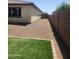 Low-maintenance backyard features green turf and gravel accents at 4866 N 185Th Dr, Goodyear, AZ 85395