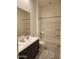 Bathroom with double sinks, a full-sized mirror, and a shower/tub combo at 4866 N 185Th Dr, Goodyear, AZ 85395