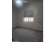 Inviting bedroom features a window and a neutral color palette at 4866 N 185Th Dr, Goodyear, AZ 85395