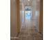 Long hallway with tile floor leading to backyard at 4866 N 185Th Dr, Goodyear, AZ 85395