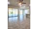 Large living room with modern ceiling fan and sliding doors leading to outdoor living area at 4866 N 185Th Dr, Goodyear, AZ 85395