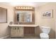 Bathroom with a vanity, toilet and mirrored medicine cabinet at 5221 E Hermosa Vista Dr, Mesa, AZ 85215