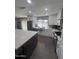 Modern kitchen features white cabinets, stainless steel appliances, a large island, and stylish backsplash tiles at 7000 N Via Camello Del Sur -- # 36, Scottsdale, AZ 85258