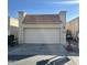 Attached garage with off-white door and terracotta tile roof at 771 E Pepper Dr, Casa Grande, AZ 85122