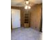 Cozy bedroom boasts tile floors, wood paneling, a ceiling fan, and built-in shelving at 7950 E Keats Ave # 194, Mesa, AZ 85209