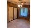 Inviting living room featuring tile floors, wood paneling, and a ceiling fan at 7950 E Keats Ave # 194, Mesa, AZ 85209