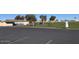Parking lot with view of clubhouse and driving range at 7950 E Keats Ave # 194, Mesa, AZ 85209
