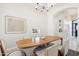 Elegant dining area with modern wooden table and sleek white chairs at 9623 W Tierra Grande --, Peoria, AZ 85383