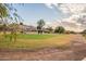 View of golf course with players in the distance at 1567 E Black Diamond Dr, Gilbert, AZ 85296