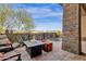 Outdoor patio with fire pit and seating area near the pool at 15961 E Ridgestone Dr, Fountain Hills, AZ 85268