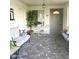 Inviting front porch with outdoor seating and decorative plants for a cozy welcome at 575 Leisure World --, Mesa, AZ 85206
