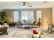 Cozy living room with ceiling fan, large window, and ample seating for Gathering and guests at 575 Leisure World --, Mesa, AZ 85206