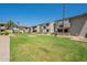 Well-manicured community lawn with walkways and landscaping at 6480 N 82Nd St # 2203, Scottsdale, AZ 85250