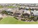 Aerial view of a residential neighborhood showcasing houses with backyard landscaping and a community park at 21576 E Pecan Ct, Queen Creek, AZ 85142