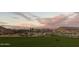 Scenic community park with lush grass and homes in the background at 21576 E Pecan Ct, Queen Creek, AZ 85142