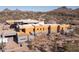 Aerial view of a contemporary home's construction in a desert landscape at 22805 N Church Rd, Scottsdale, AZ 85255