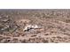 Aerial view of a modern home under construction in a desert setting at 22805 N Church Rd, Scottsdale, AZ 85255