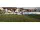 Contemporary home with a large pool and lush lawn at 22805 N Church Rd, Scottsdale, AZ 85255