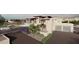 Three-car garage with modern design and desert landscaping at 22805 N Church Rd, Scottsdale, AZ 85255