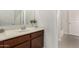 Bathroom showcasing a vanity with a stylish sink and modern faucet at 2578 N Acacia Way, Buckeye, AZ 85396