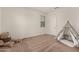 Spacious bedroom featuring carpeted floors and a decorative play tent at 2578 N Acacia Way, Buckeye, AZ 85396