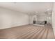Bright living room with neutral carpet and ample space for furniture arrangement at 2578 N Acacia Way, Buckeye, AZ 85396