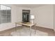 Well-lit office area with a desk, white rug, and a window, offering a comfortable and productive workspace at 2578 N Acacia Way, Buckeye, AZ 85396