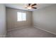 Bright bedroom with ceiling fan and window coverings at 42158 W Somerset Dr, Maricopa, AZ 85138