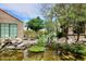 Beautiful backyard pond with lush greenery and rock features, creating a serene outdoor space at 5122 E Shea Blvd # 1117, Scottsdale, AZ 85254